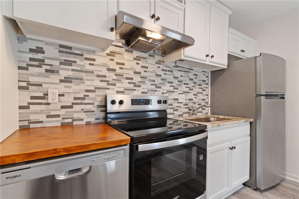 1382 Branch Drive Tucker, GA 30084 - Photo 2 of 29 a kitchen with a stove and a refrigerator