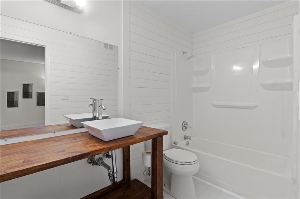 1382 Branch Drive Tucker, GA 30084 - Photo 21 of 29 a bathroom with a sink a toilet and shower