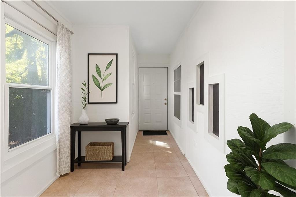 1382 Branch Drive Tucker, GA 30084 - Photo 25 of 29 a living room with furniture and a potted plant