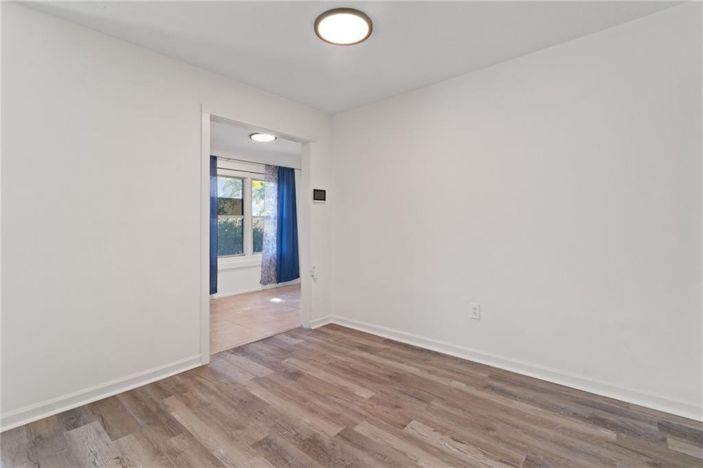1382 Branch Drive Tucker, GA 30084 - Photo 4 of 29 an empty room with wooden floor and windows