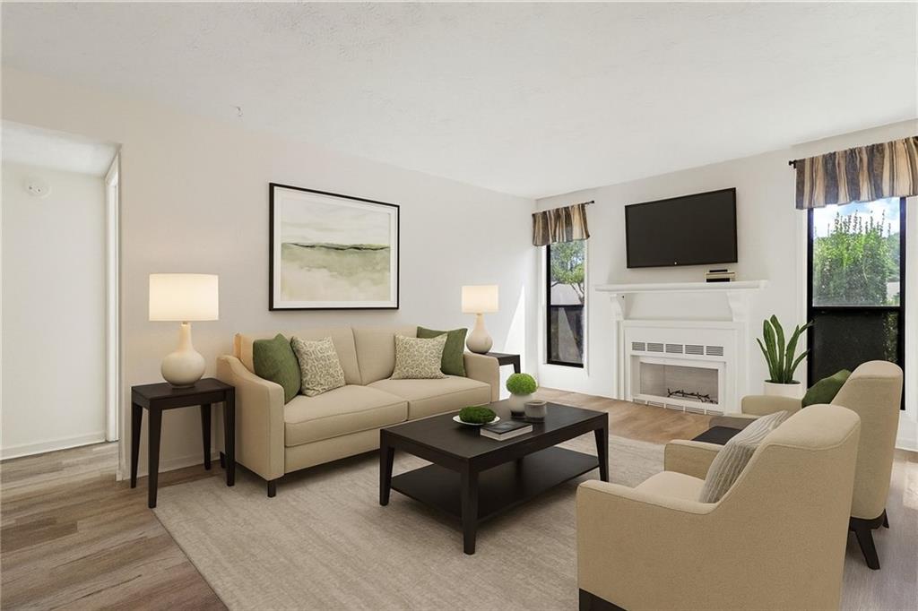 1382 Branch Drive Tucker, GA 30084 - Photo 5 of 29 a living room with fireplace furniture and a flat screen tv