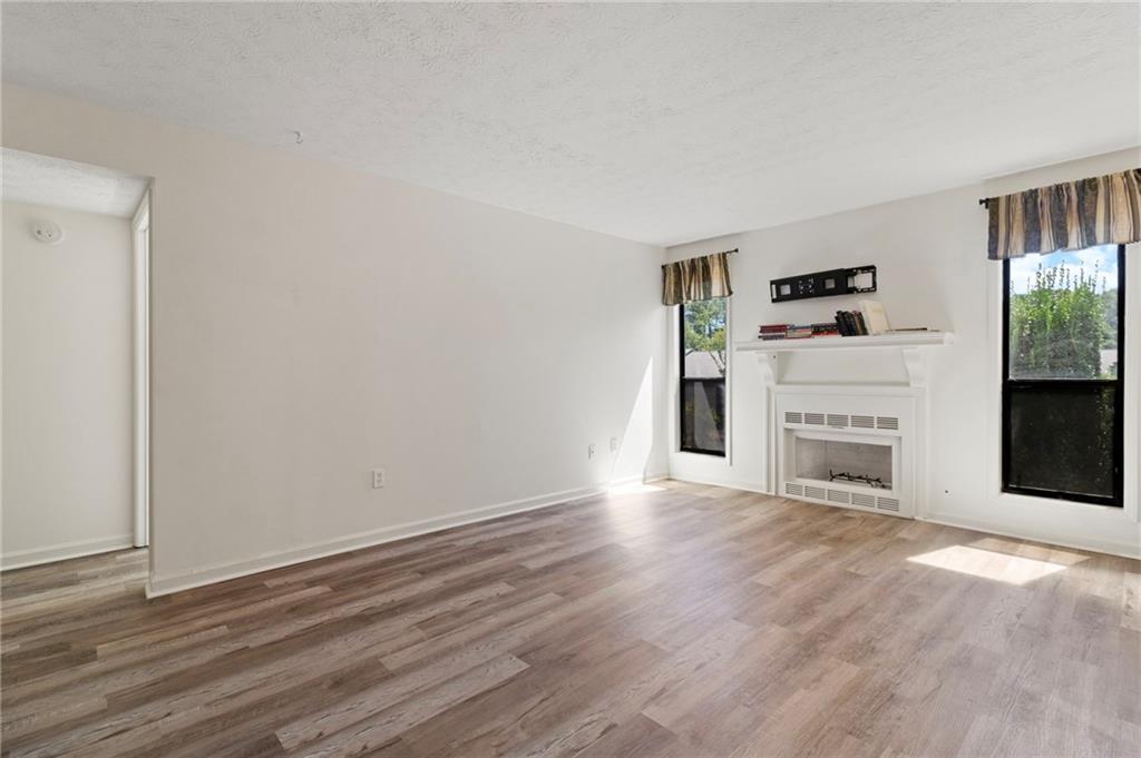 1382 Branch Drive Tucker, GA 30084 - Photo 6 of 29 wooden floor fireplace and natural light in room