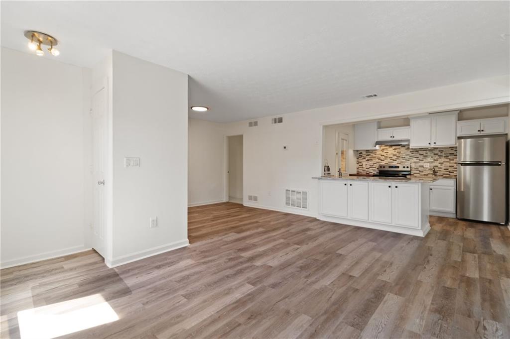 1382 Branch Drive Tucker, GA 30084 - Photo 7 of 29 a view of a kitchen with a sink and wooden floor