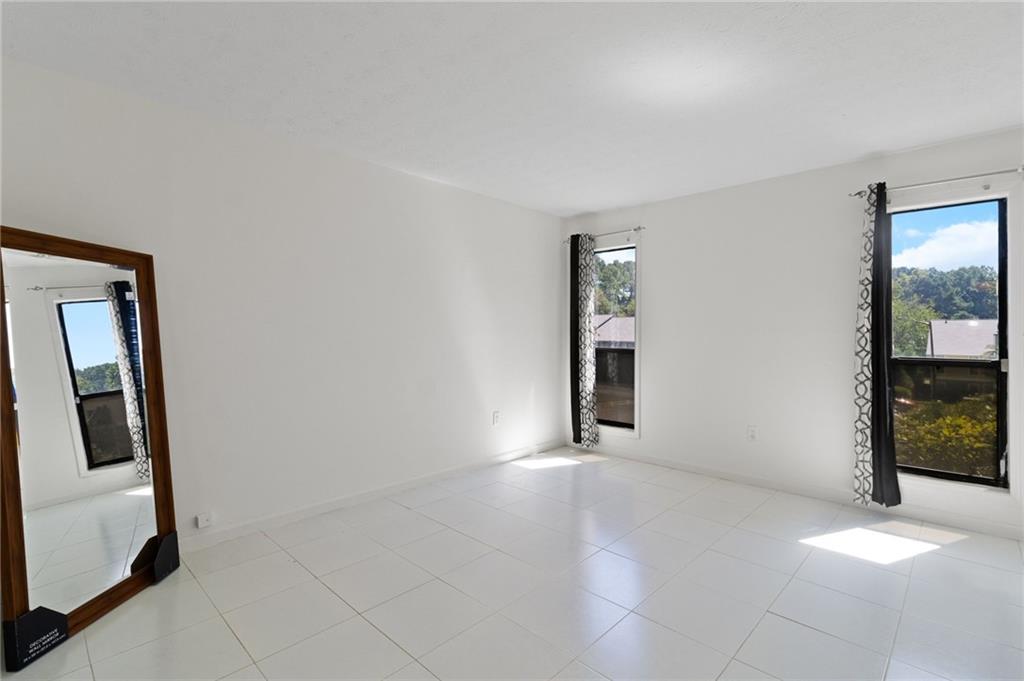 1382 Branch Drive Tucker, GA 30084 - Photo 9 of 29 an empty room with windows and closet