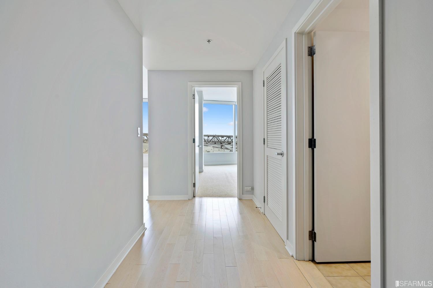 301 Main Street, Unit 17E San Francisco, CA 94105 - Photo 11 of 22 a view of a hallway with wooden floor