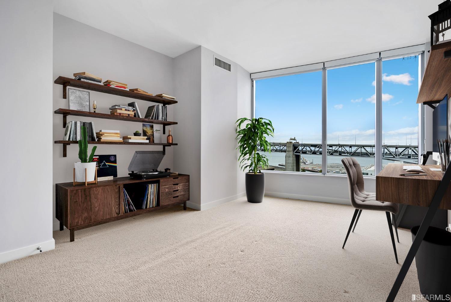 301 Main Street, Unit 17E San Francisco, CA 94105 - Photo 12 of 22 a workspace with furniture and a potted plant