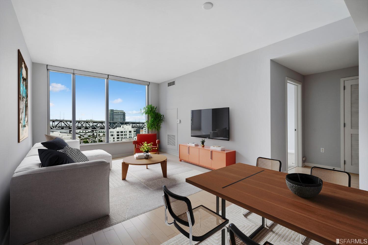 301 Main Street, Unit 17E San Francisco, CA 94105 - Photo 3 of 22 a living room with furniture and a flat screen tv