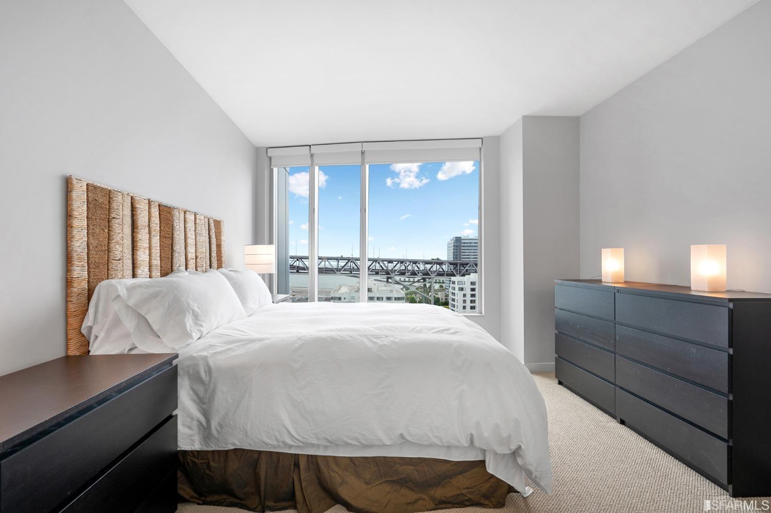 301 Main Street, Unit 17E San Francisco, CA 94105 - Photo 7 of 22 a bedroom with a large bed and a window