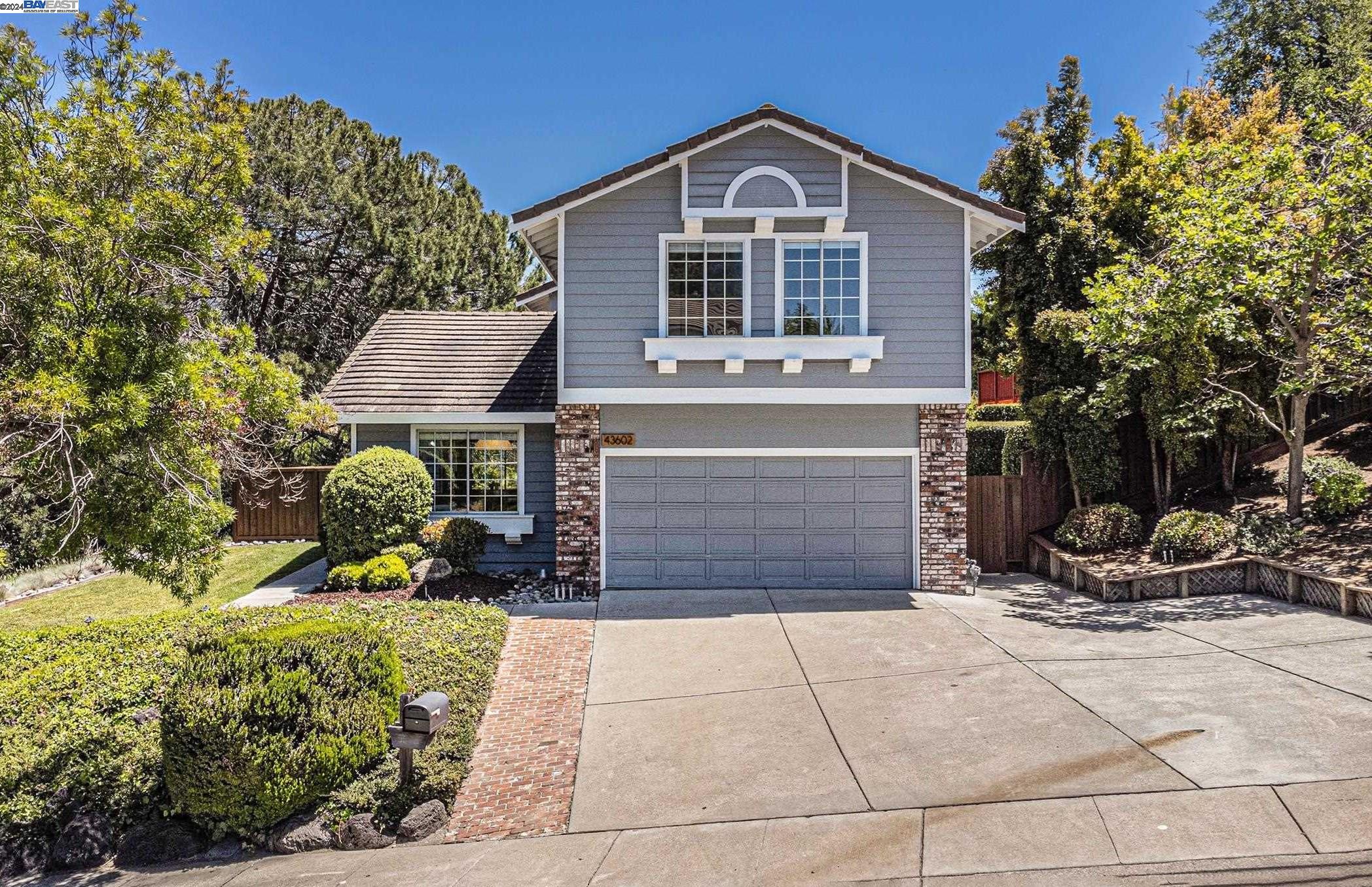 43602 Skye Road Fremont, CA 94539 - Photo 1 of 1 a front view of a house with garden