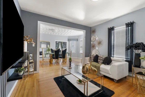 a living room with furniture and a flat screen tv