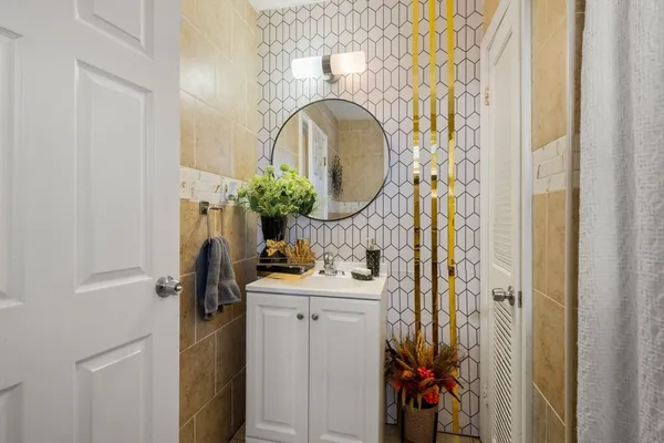 a bathroom with a sink and a mirror