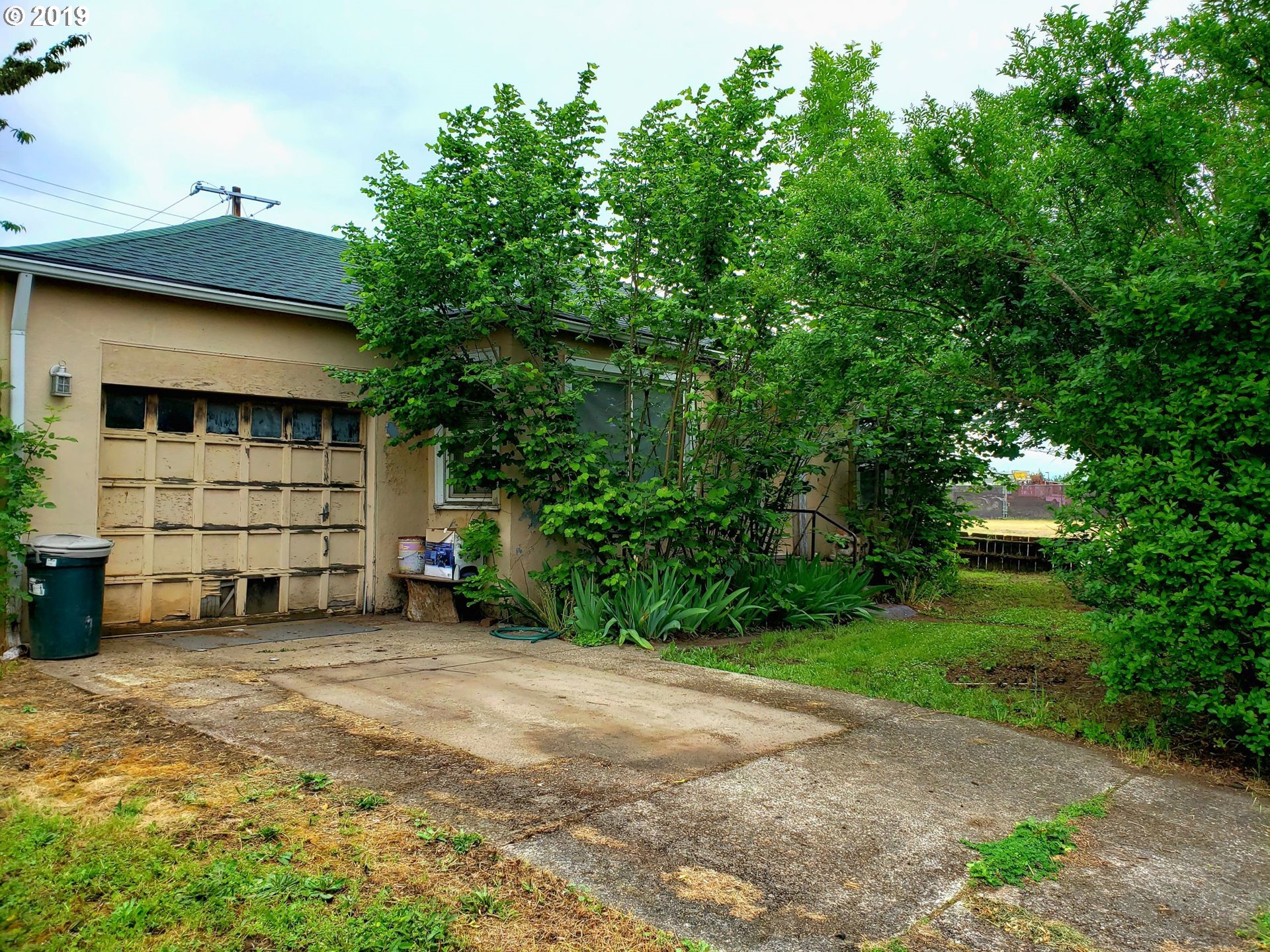 2780 E Street Springfield, OR 97477 - Photo 2 of 15 a view of a car garage with a car parked in it