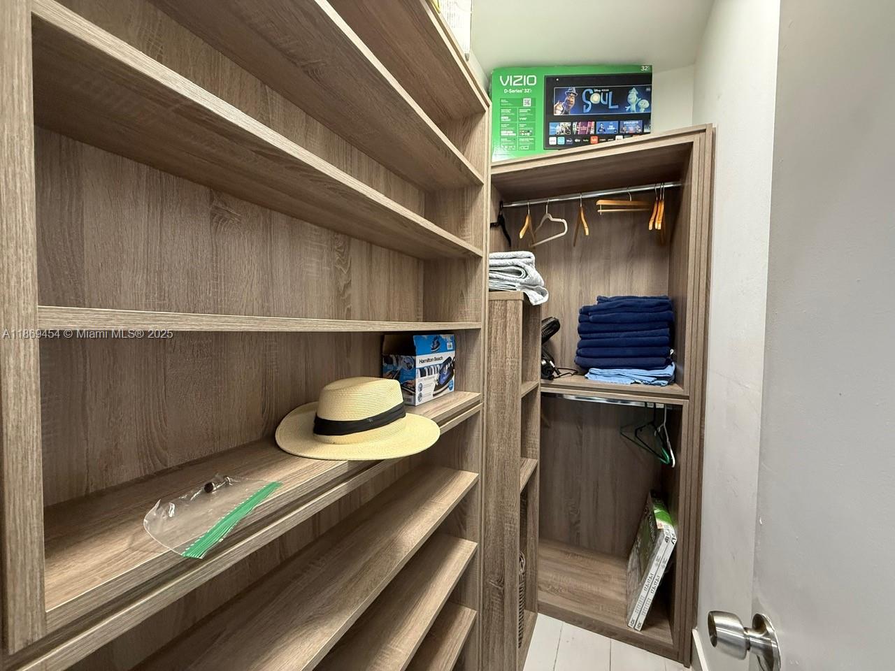 247 Northwest 58th Street Miami, FL 33127 - Photo 21 of 23 a hallway with a wooden floor and chair