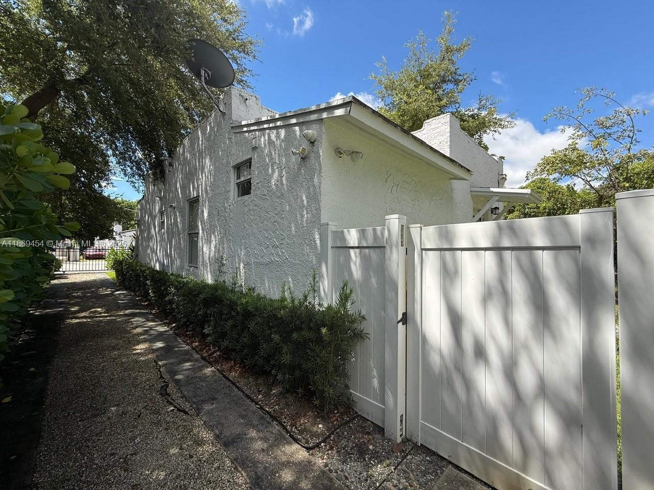 247 Northwest 58th Street Miami, FL 33127 - Photo 4 of 23 a backyard of a house with lots of green space