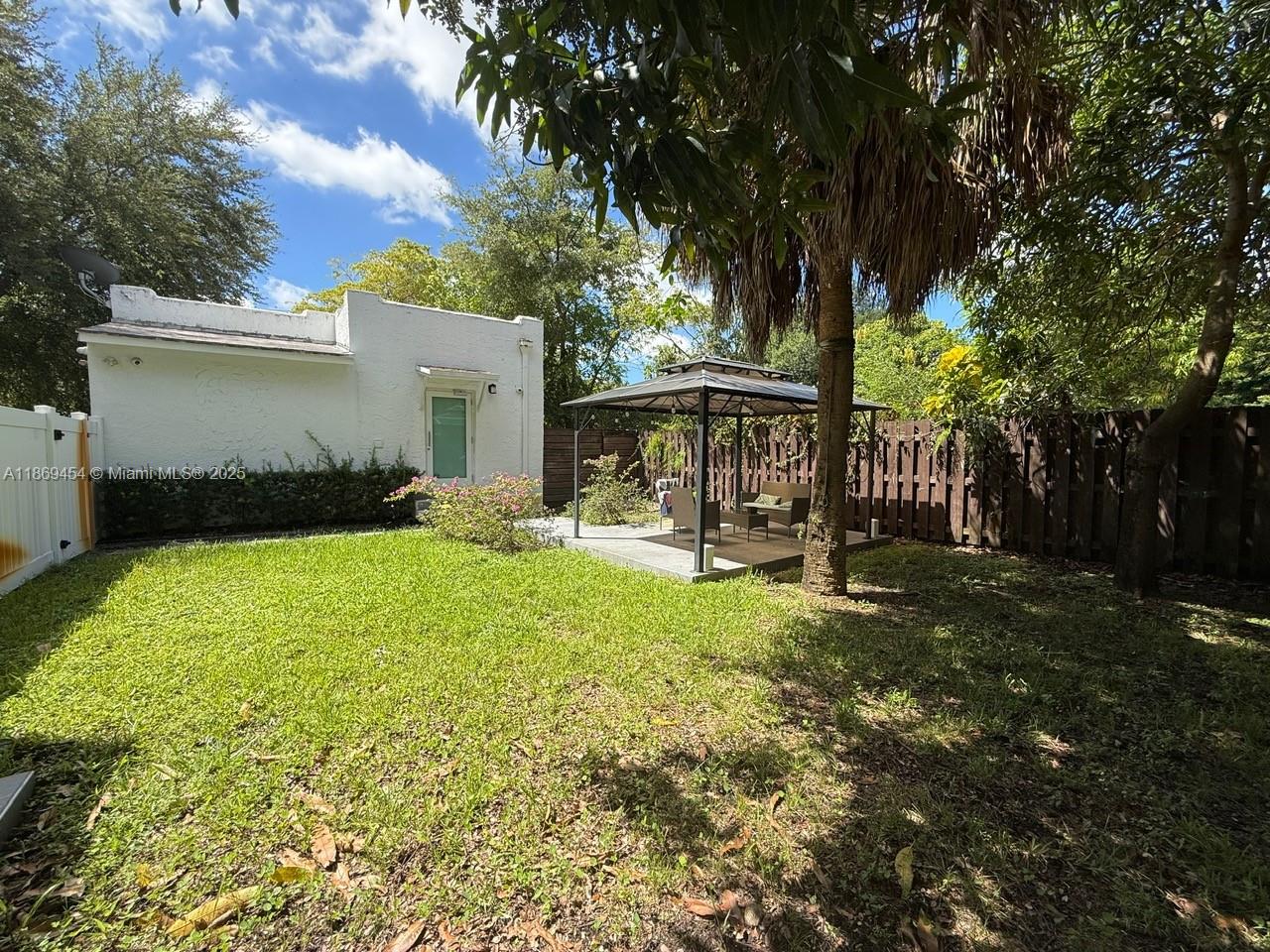 247 Northwest 58th Street Miami, FL 33127 - Photo 6 of 23 a view of a house with backyard and sitting area
