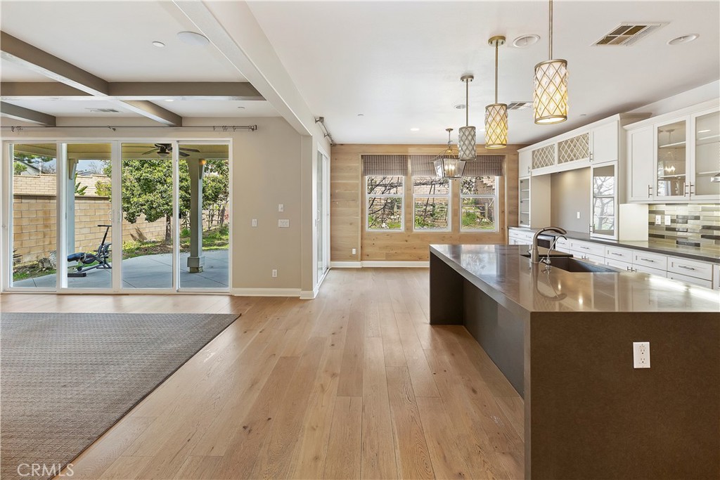 11548 Grimaldi Road Rancho Cucamonga, CA 91701 - Photo 13 of 39 a large kitchen with stainless steel appliances granite countertop a large window