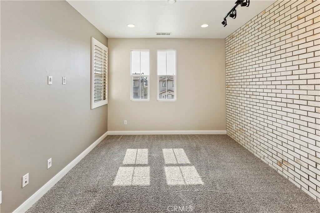 11548 Grimaldi Road Rancho Cucamonga, CA 91701 - Photo 23 of 39 a view of an empty room and a window