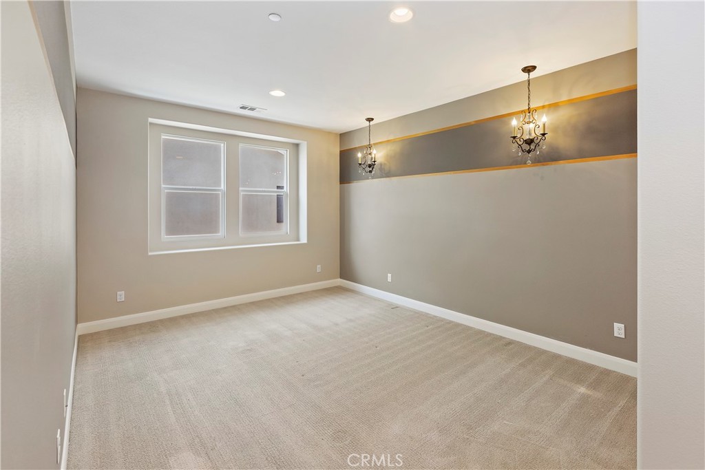 11548 Grimaldi Road Rancho Cucamonga, CA 91701 - Photo 24 of 39 a view of an empty room with a window