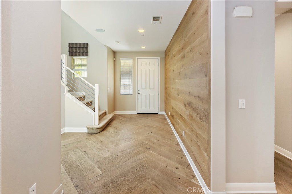 11548 Grimaldi Road Rancho Cucamonga, CA 91701 - Photo 8 of 39 a view of a hallway with staircase