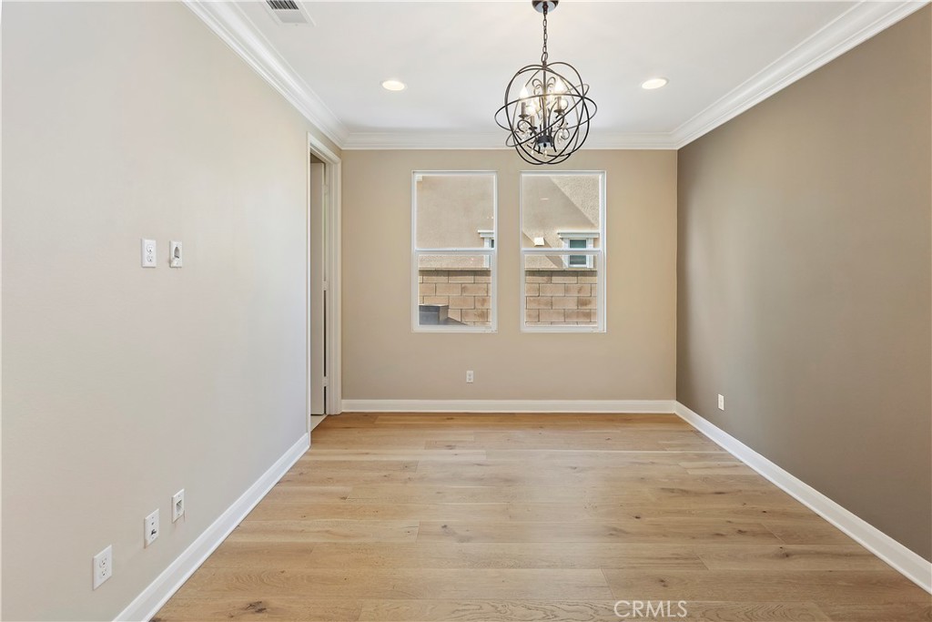 11548 Grimaldi Road Rancho Cucamonga, CA 91701 - Photo 10 of 39 a view of an empty room with a window