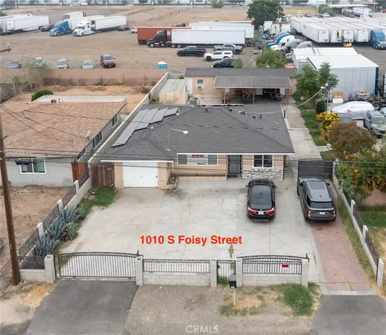 an aerial view of a house with garage