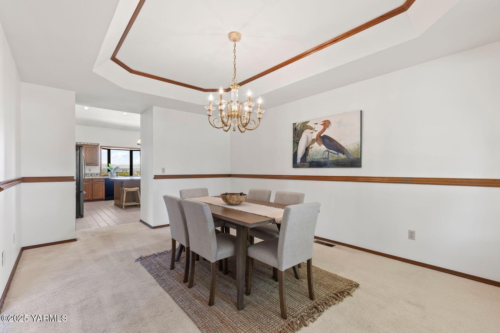 720 Country Club Drive Yakima, WA 98901 - Photo 12 of 48 a view of a dining room with furniture and chandelier