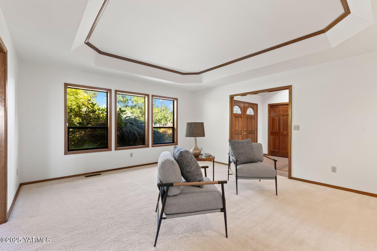 720 Country Club Drive Yakima, WA 98901 - Photo 14 of 48 a living room with furniture and a floor to ceiling window