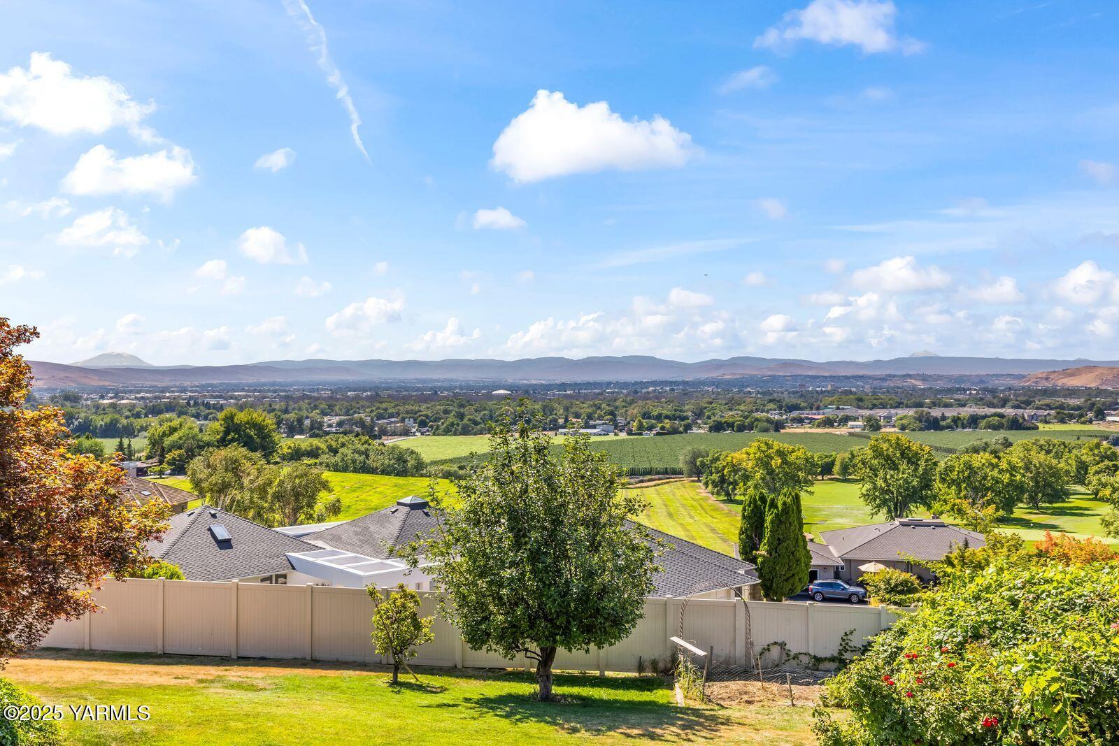 720 Country Club Drive Yakima, WA 98901 - Photo 18 of 48 a view of a swimming pool with a lounge chair
