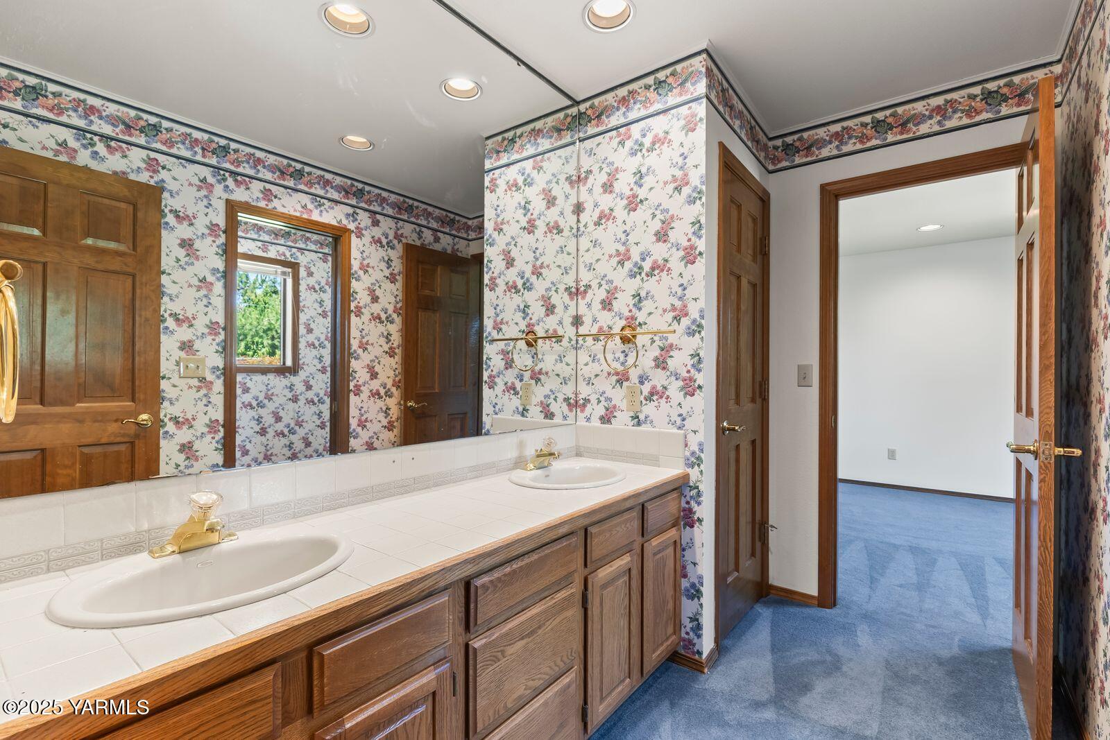 720 Country Club Drive Yakima, WA 98901 - Photo 29 of 48 a bathroom with a double vanity sink mirror and shower