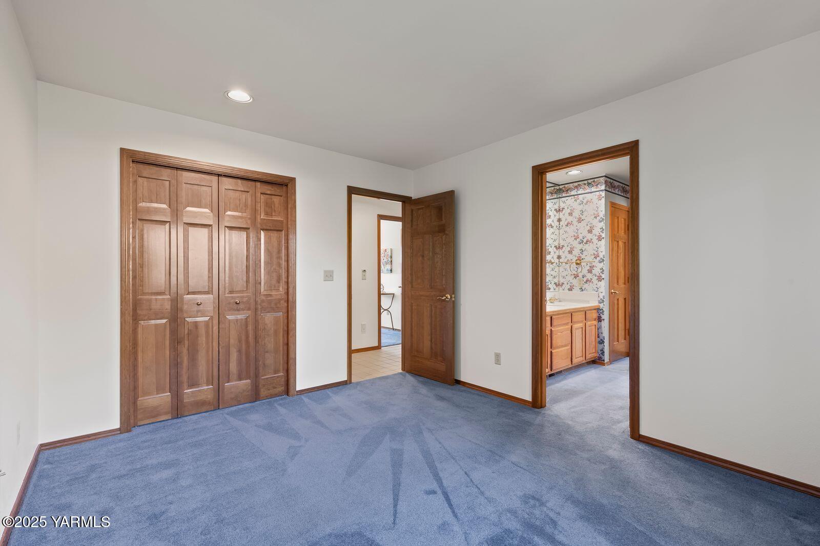 720 Country Club Drive Yakima, WA 98901 - Photo 32 of 48 a view of an empty room with wooden floor and closet