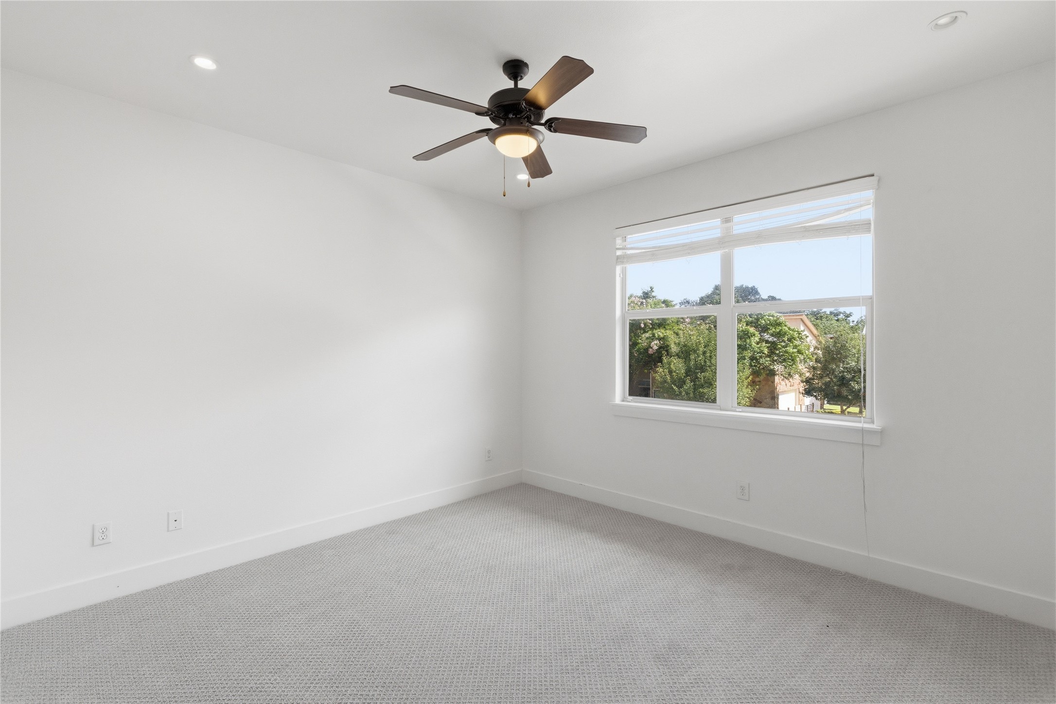 4124 Valley View Road, Unit 4A & 4B Austin, TX 78704 - Photo 35 of 40 A well-lit bedroom features plush carpeting and a large window framing verdant outdoor scenery.