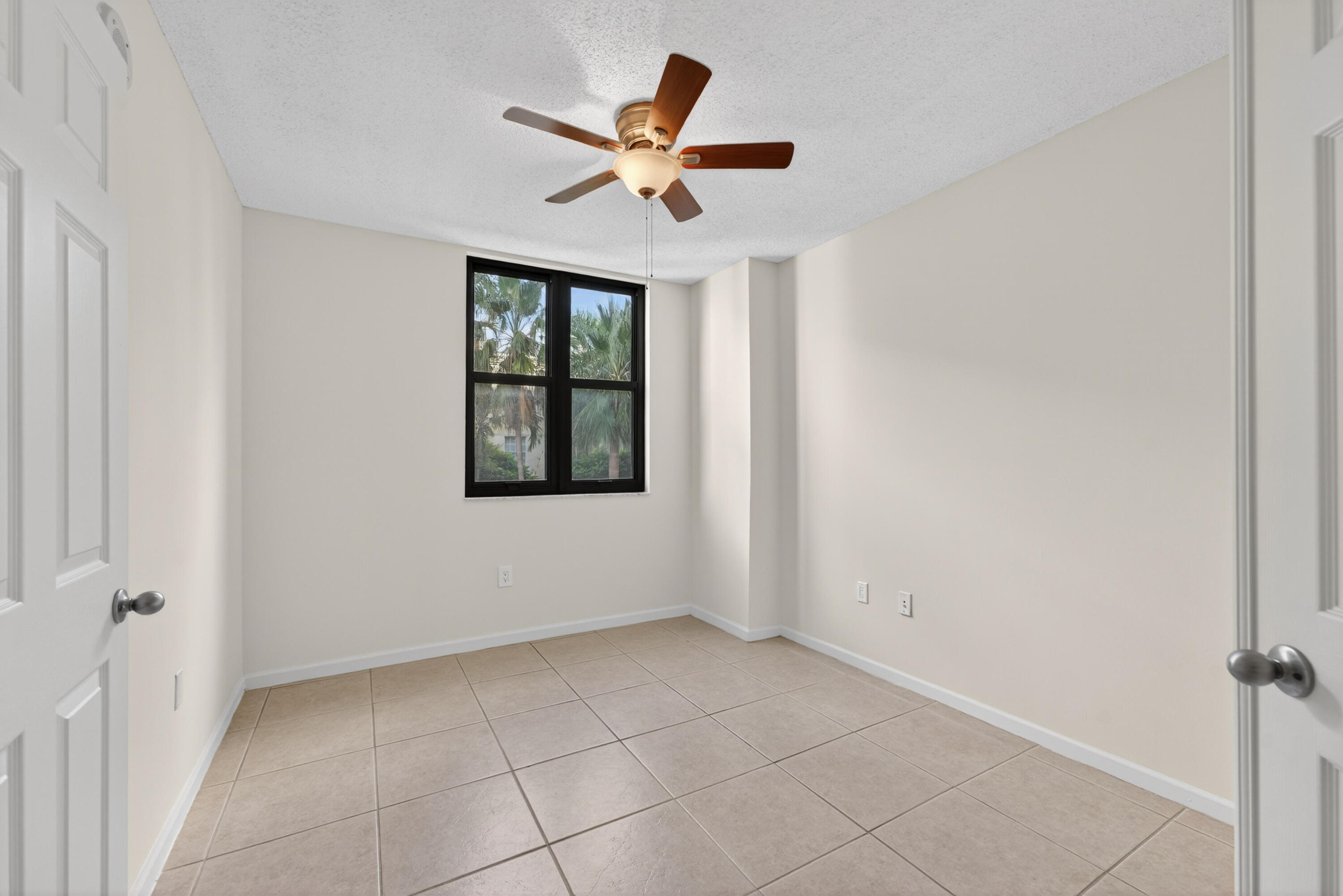 651 Okeechobee Boulevard, Unit 302 West Palm Beach, FL 33401 - Photo 13 of 29 a view of an empty room with a window