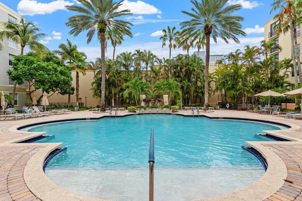 651 Okeechobee Boulevard, Unit 302 West Palm Beach, FL 33401 - Photo 23 of 29 a view of a swimming pool with a chair