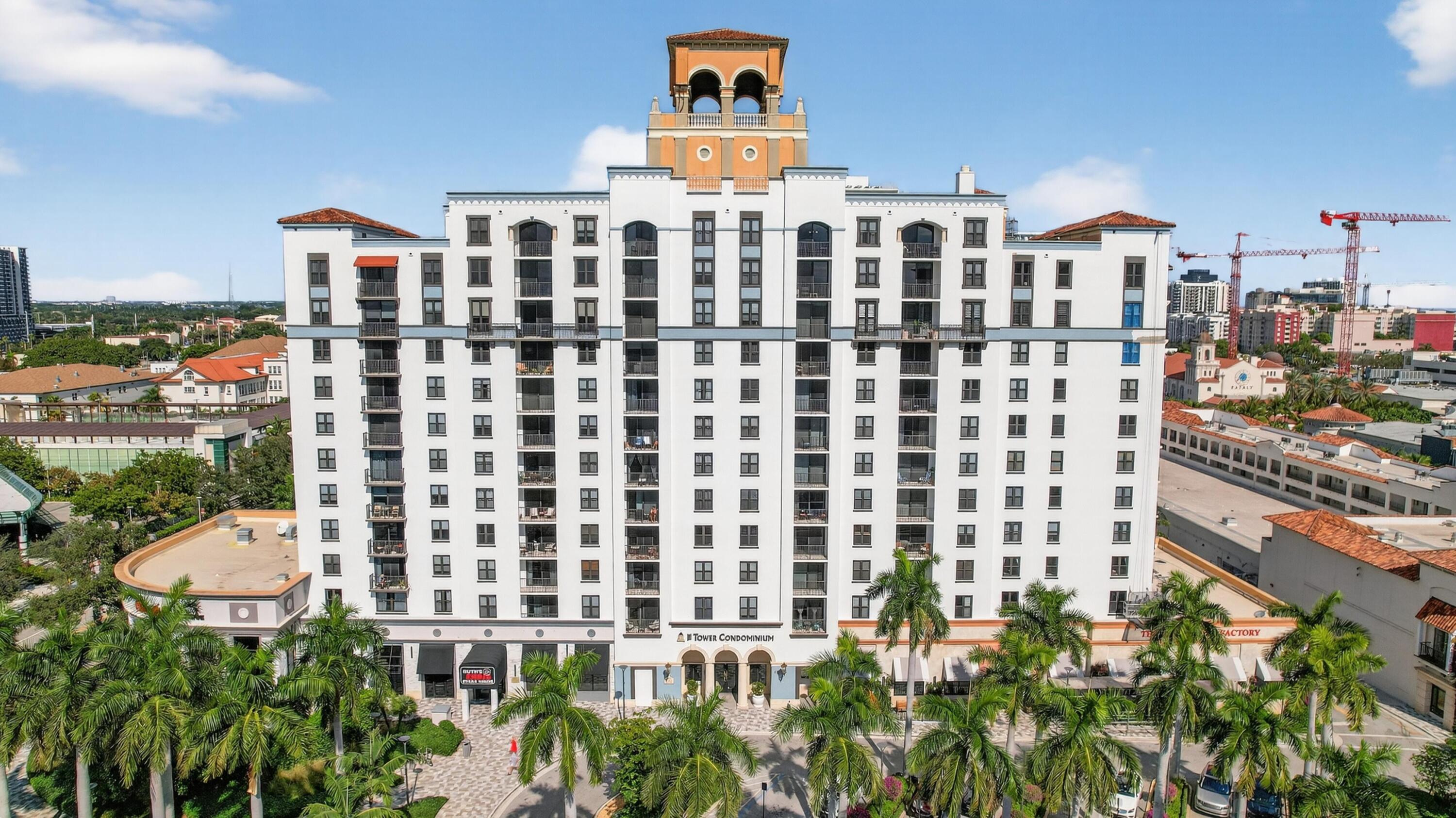 651 Okeechobee Boulevard, Unit 302 West Palm Beach, FL 33401 - Photo 24 of 29 a front view of a building with a garden