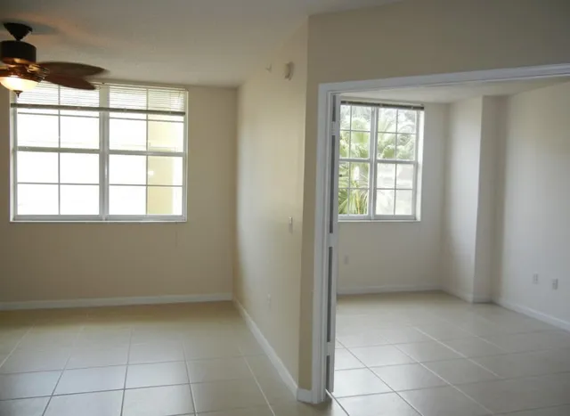 a view of an empty room with a window