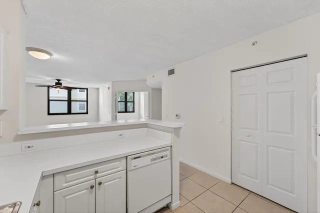 a view with cabinets and window