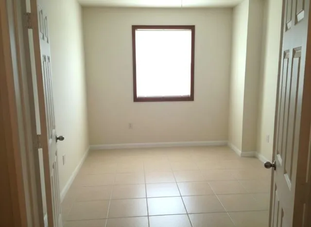 a view of an empty room with a window