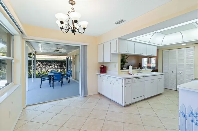 a kitchen with cabinets and window
