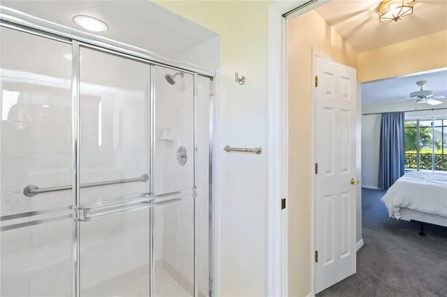 a bathroom with a glass shower door