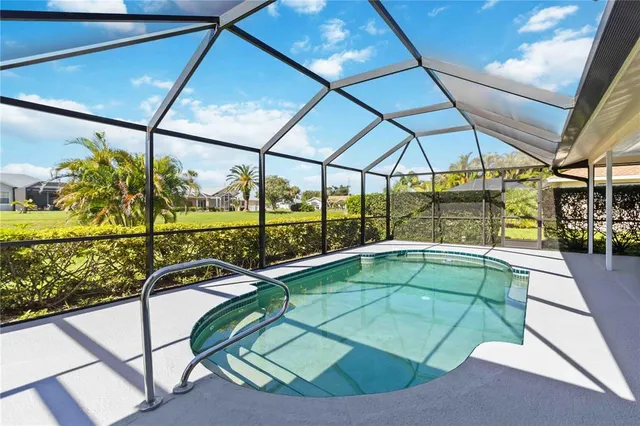 a view of a swimming pool with a porch