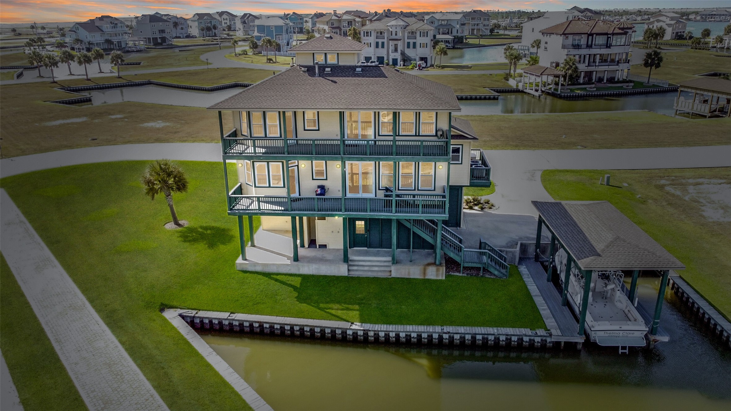 an aerial view of a house with a lake view