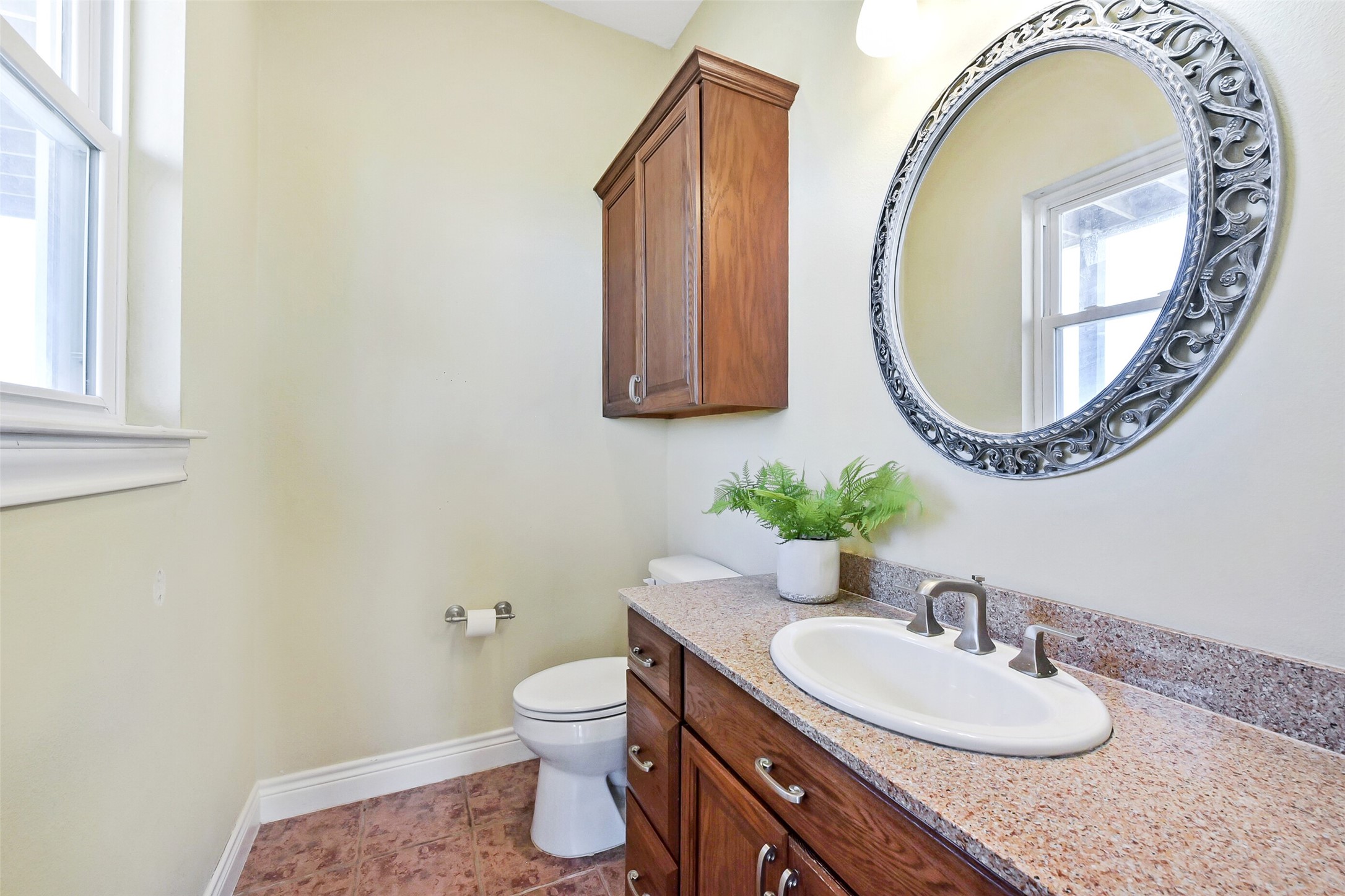 1 Loggerhead Hitchcock, TX 77563 - Photo 16 of 49 a bathroom with a granite countertop sink and a mirror