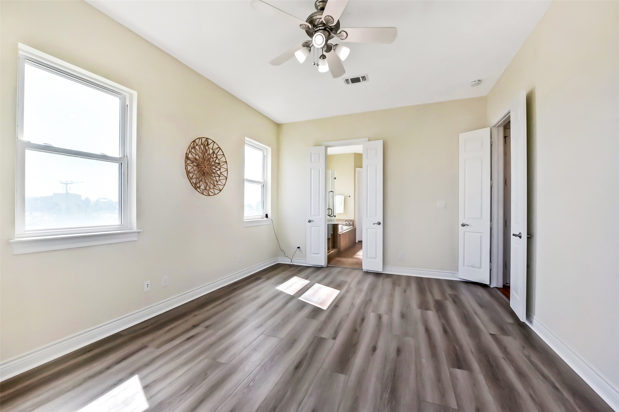 1 Loggerhead Hitchcock, TX 77563 - Photo 18 of 49 a view of an empty room with a window and wooden floor