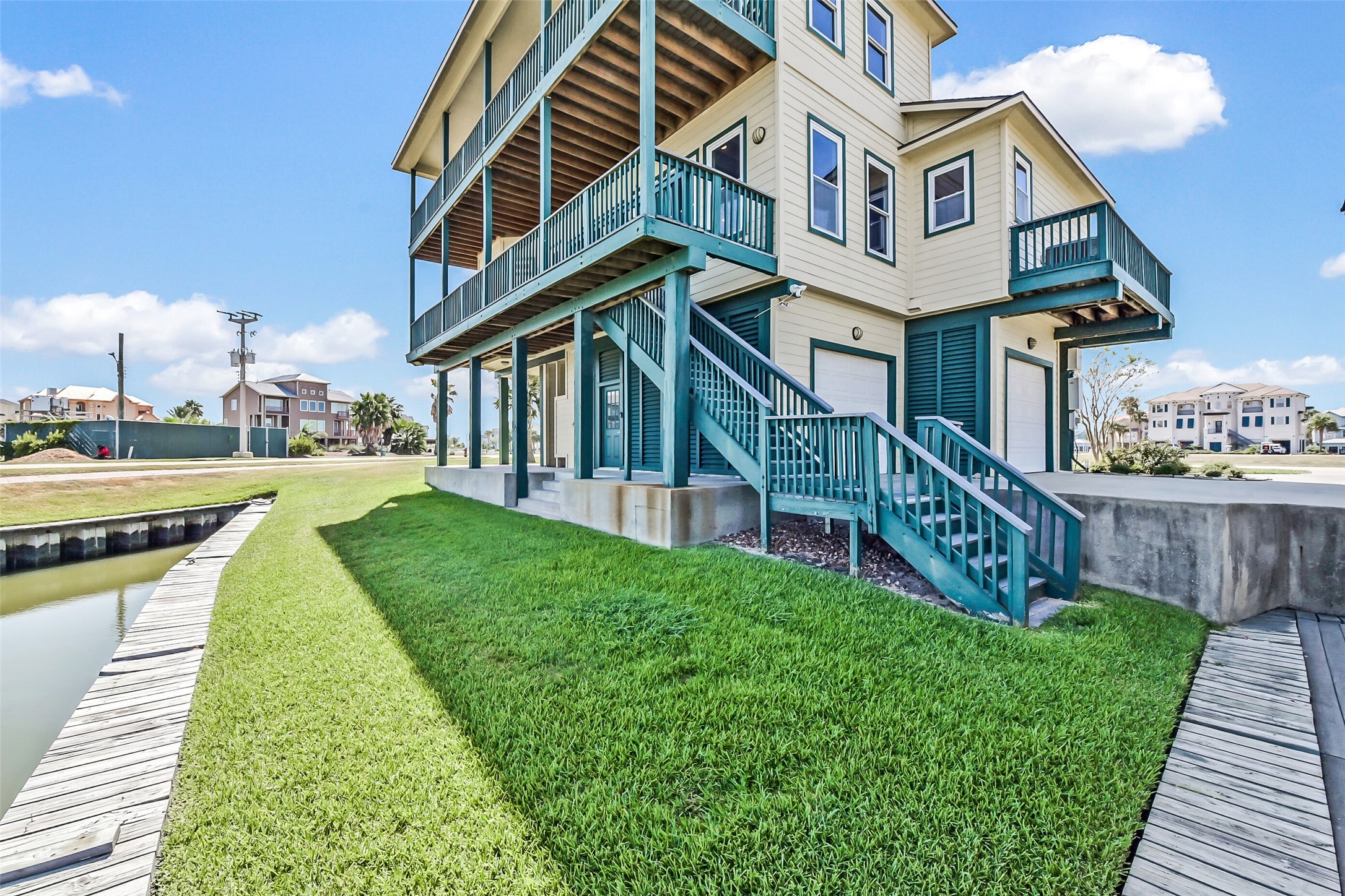 1 Loggerhead Hitchcock, TX 77563 - Photo 6 of 49 Take in the breeze and views on one of the multiple balconies this home offers. Treated decking on the balconies.