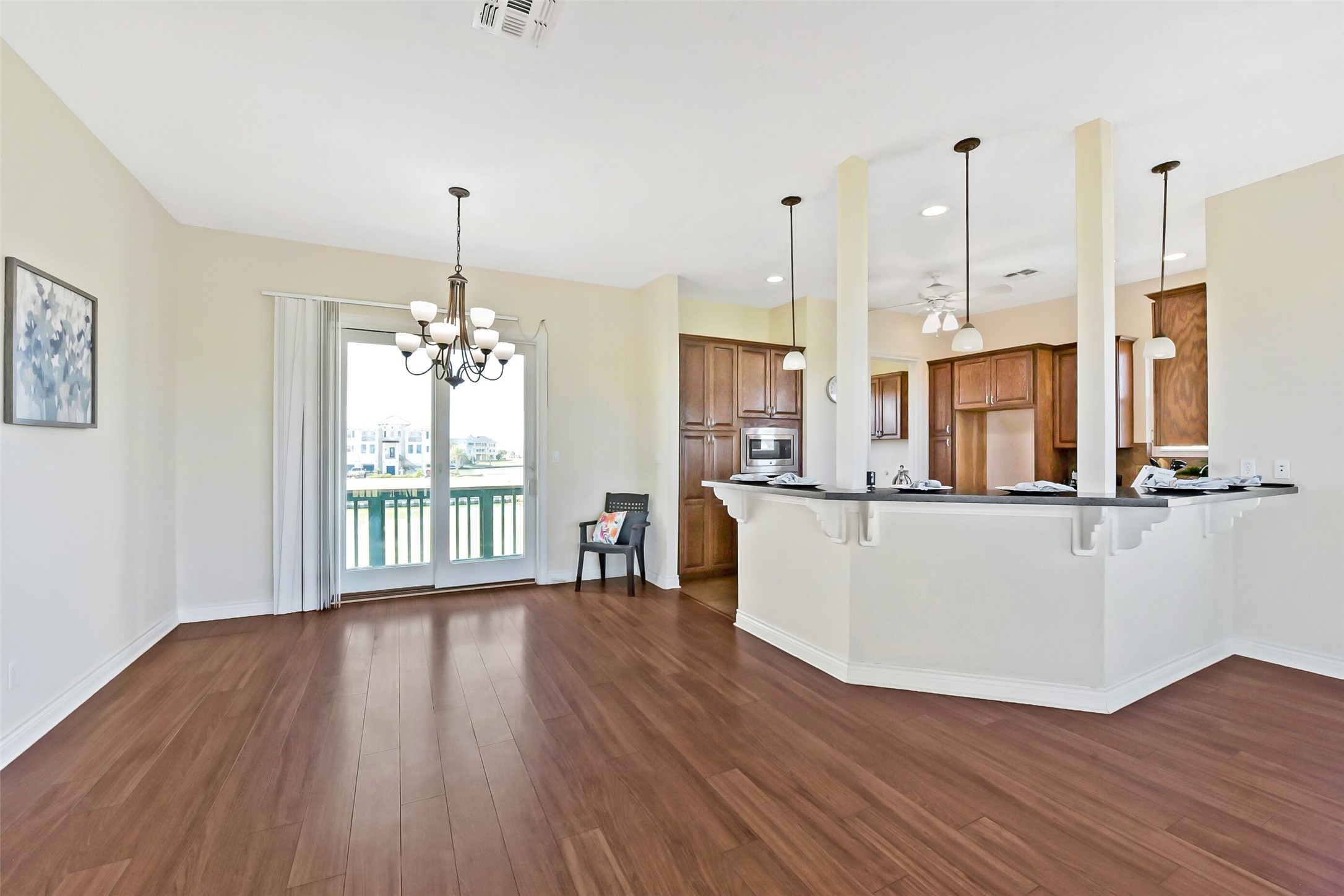 1 Loggerhead Hitchcock, TX 77563 - Photo 49 of 49 Open floor plan is perfect for entertaining. View of kitchen, dining and living.