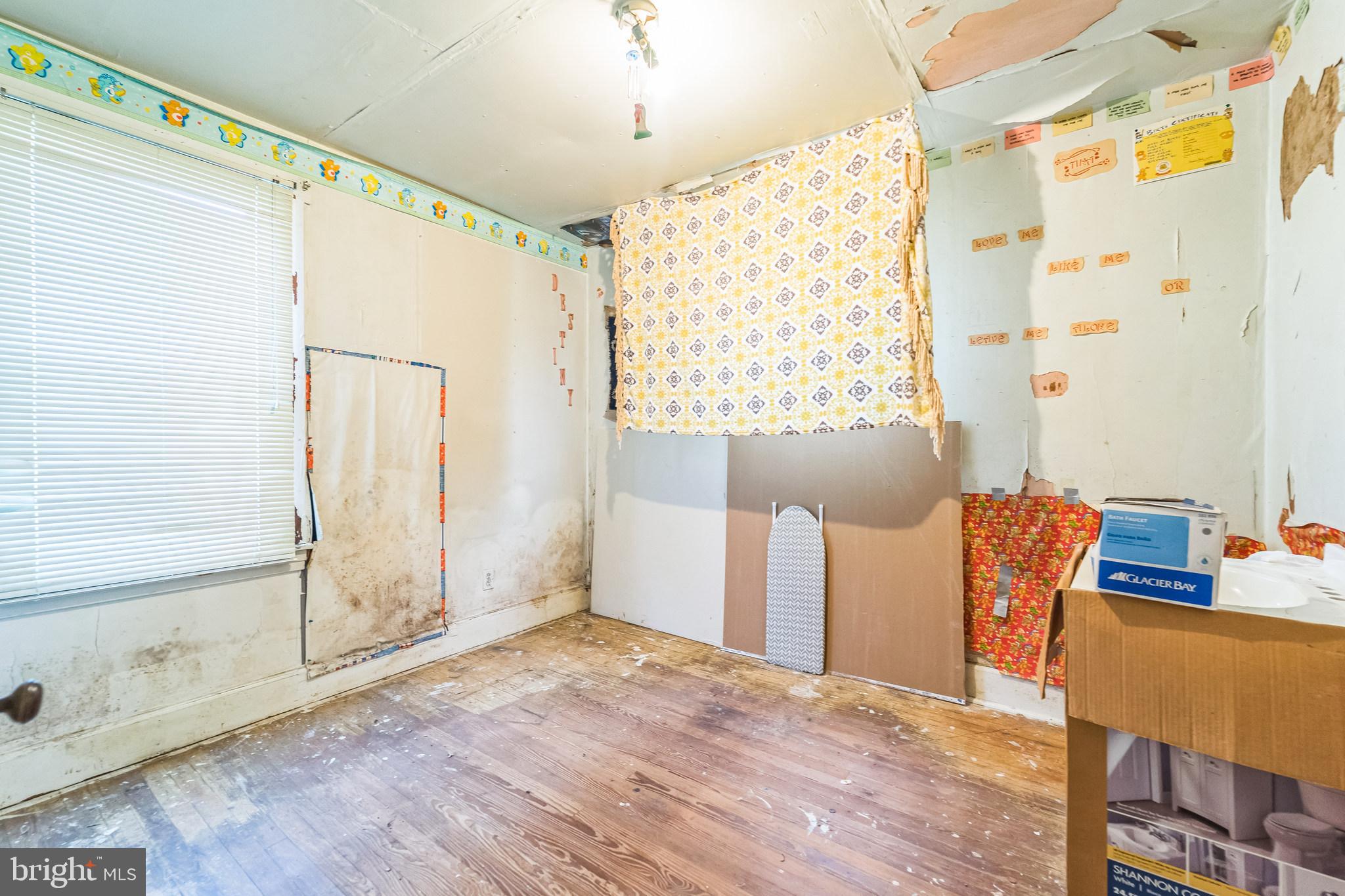 912 Windsor Avenue Annapolis, MD 21403 - Photo 18 of 29 a view of an empty room with window and cabinet