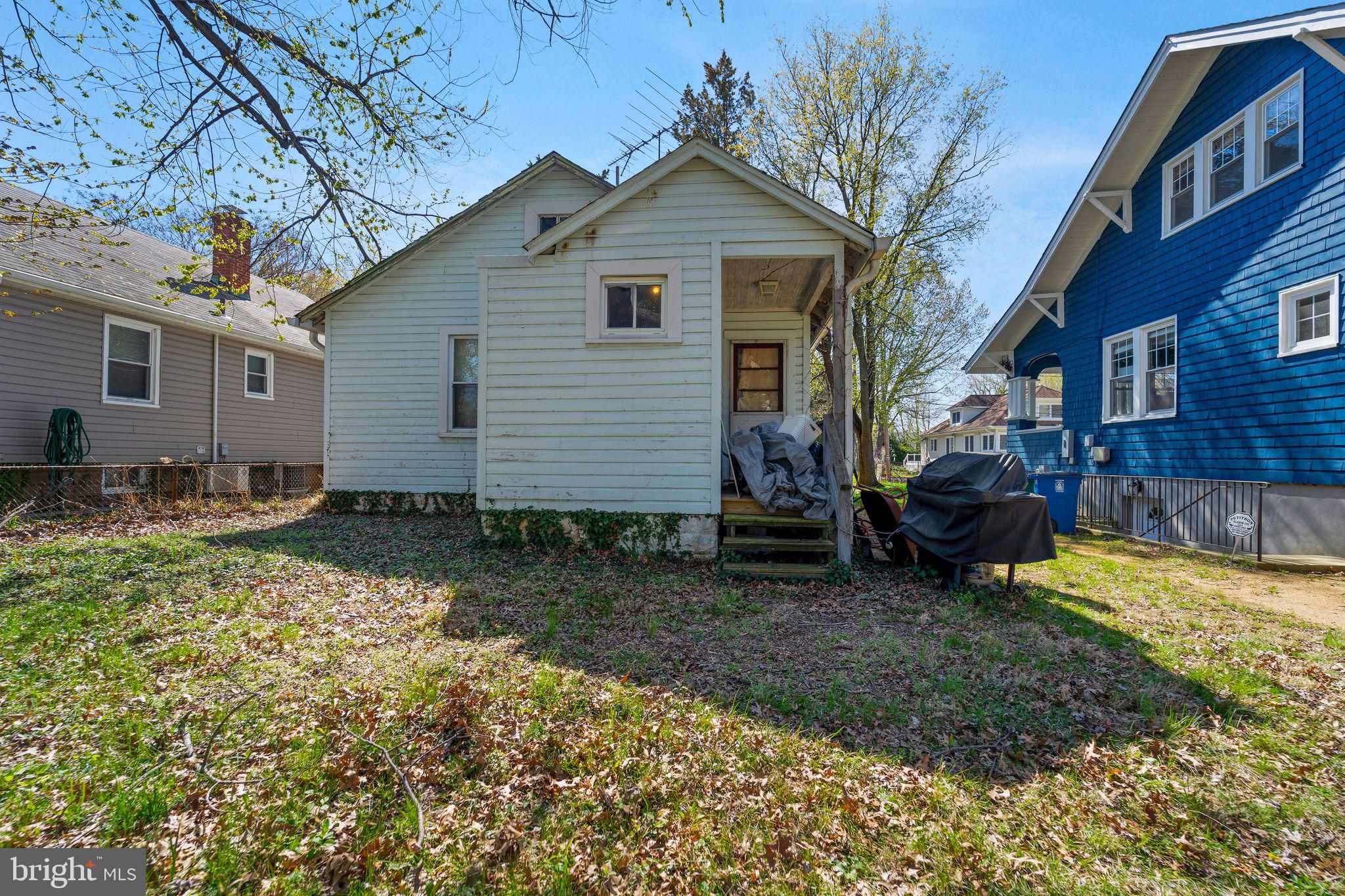 912 Windsor Avenue Annapolis, MD 21403 - Photo 24 of 29 a view of a house with a yard covered in the forest