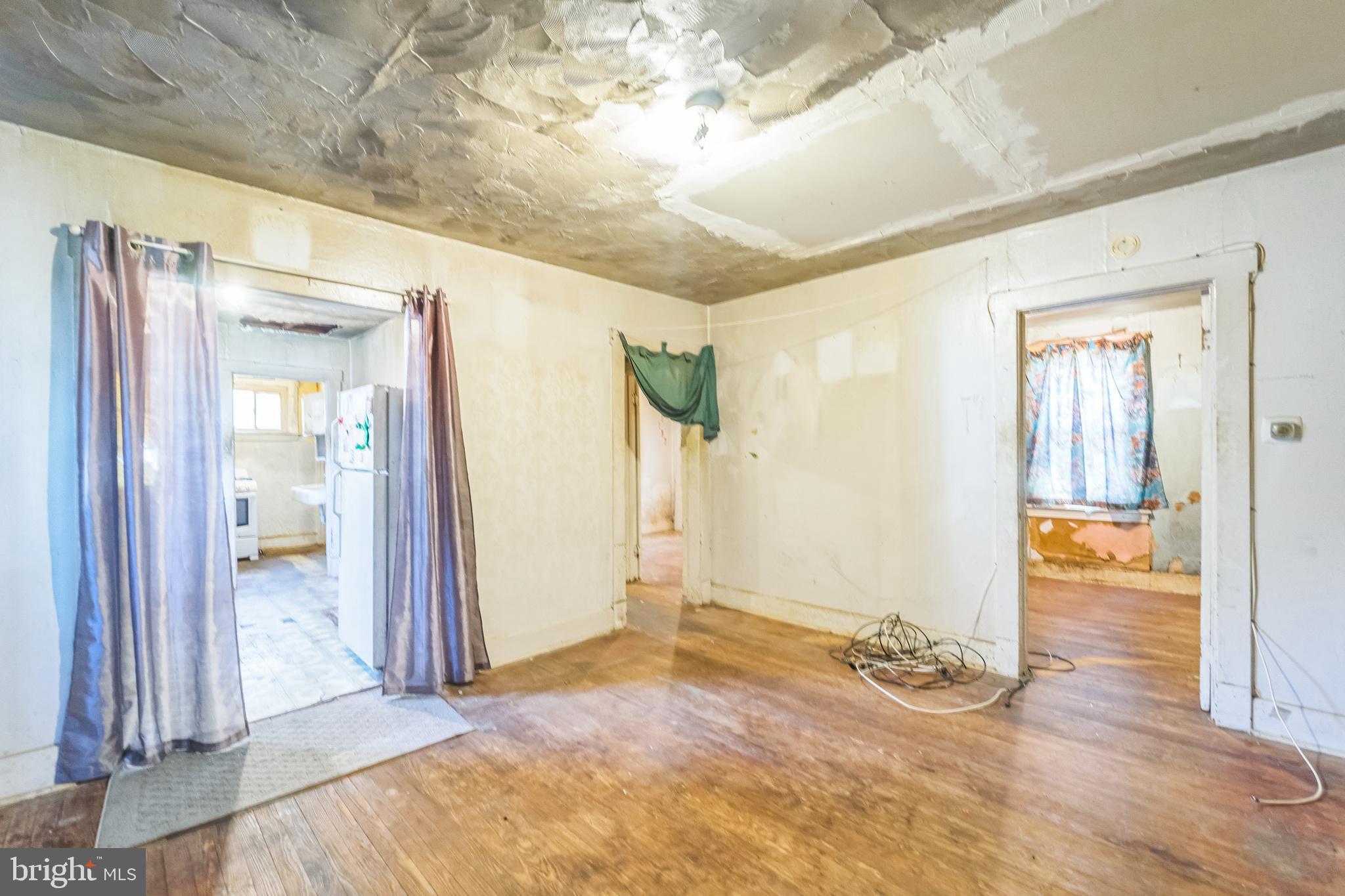 912 Windsor Avenue Annapolis, MD 21403 - Photo 10 of 29 an empty room with wooden floor and windows