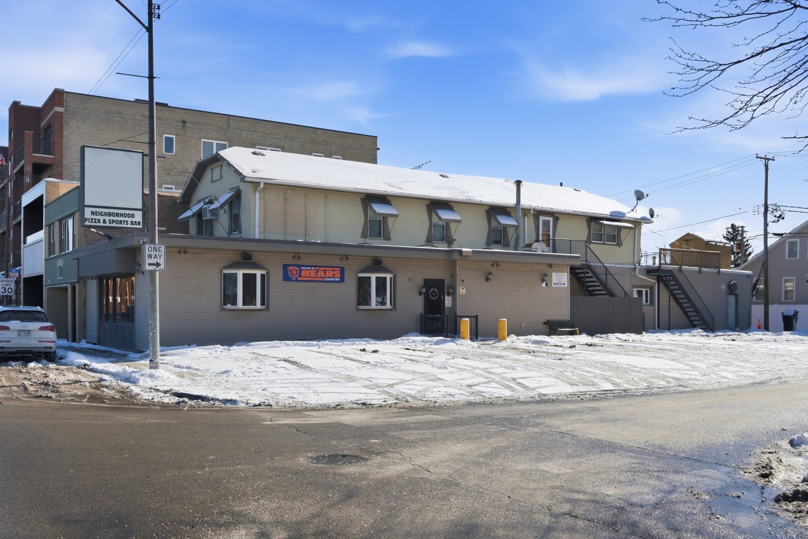 7455 West Irving Park Road Chicago, IL 60634 - Photo 1 of 1 a swimming pool with buildings in front of it