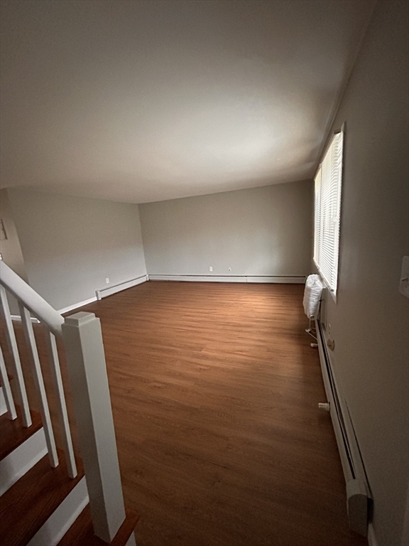5 Manor Court, Unit 5 Springfield, MA 01118 - Photo 12 of 19 a view of room with stairs and wooden floor
